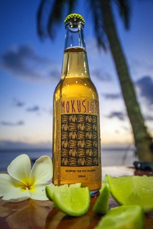 Mokusiga beer bottle frangipani lime palm tree