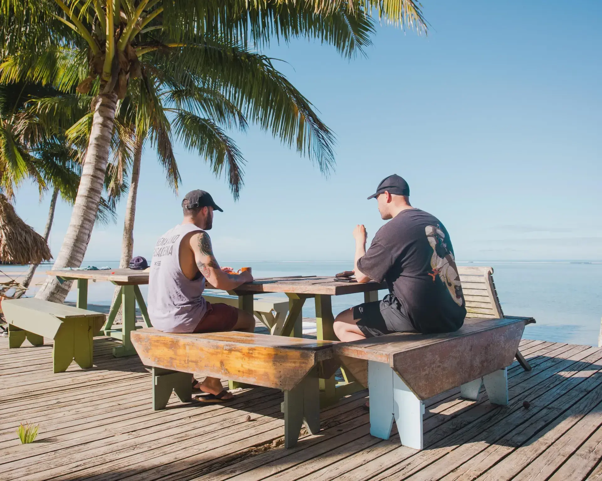 Guests relaxing on beachfront deck